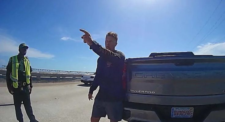 U.S. Immigration and Customs Enforcement Agent Scott Deiseroth speaks with Monroe County Sheriff’s Office deputies during a driving under the influence stop on the Bahia Honda Bridge Wednesday, Aug. 13, 2025. During the traffic stop, Deiseroth questioned the U.S. citizenship of one of the deputies involved in his arrest, asking whether he was Haitian.