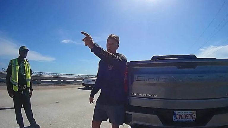 U.S. Immigration and Customs Enforcement Agent Scott Deiseroth speaks with Monroe County Sheriff’s Office deputies during a driving under the influence stop on the Bahia Honda Bridge Wednesday, Aug. 13, 2025. During the traffic stop, Deiseroth questioned the U.S. citizenship of one of the deputies involved in his arrest, asking whether he was Haitian.