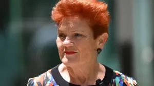pauline-hanson-presser-one-nation-senator-pauline-hanson-arrives-to-speak-to-the-media-during-a-pres.webp